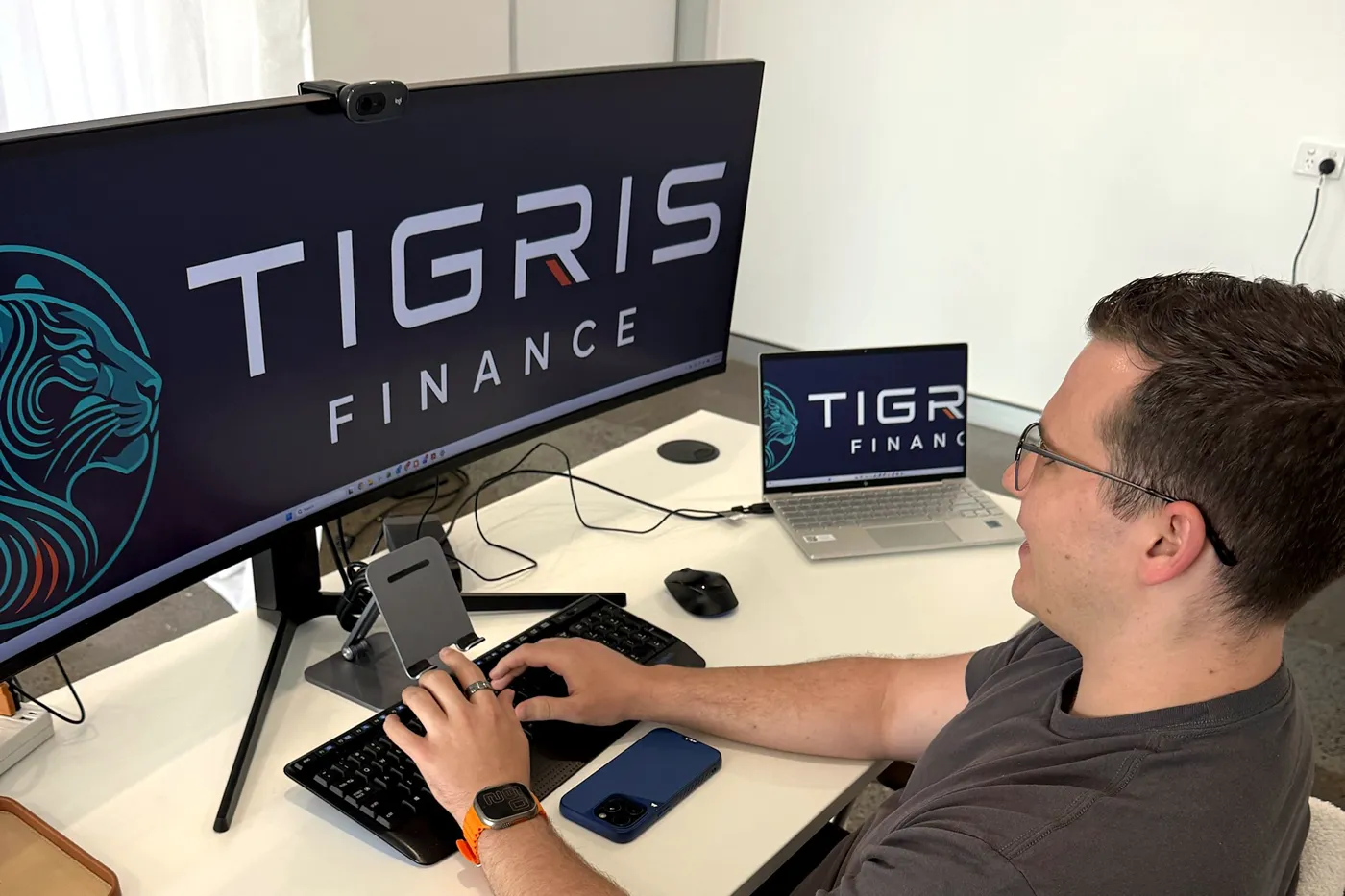 Wade Hogan working at his desk at Tigris Finance
