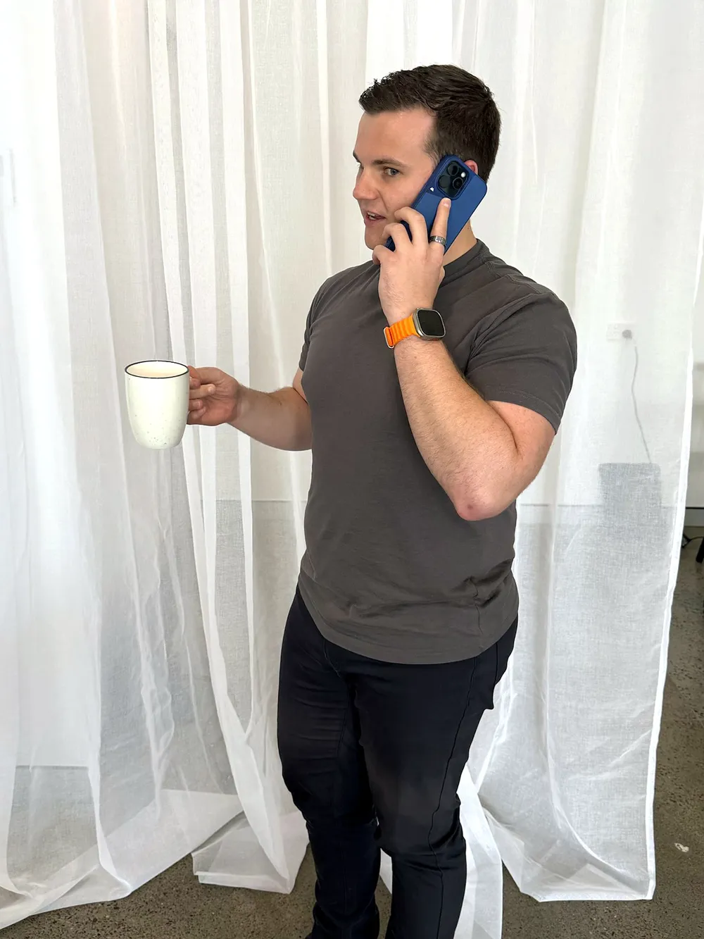 Wade Hogan on a call with a client at the Tigris Finance office
